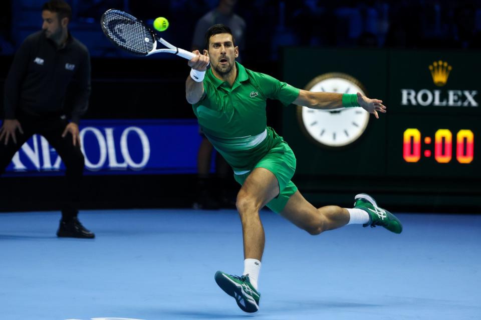 Novak Djokovic of Serbia plays a forehand shot during his Round Robin Singles match against Stefanos Tsitsipas of Greece during day two of the Nitto ATP Finals at Pala Alpitour on November 14, 2022 in Turin, Italy.