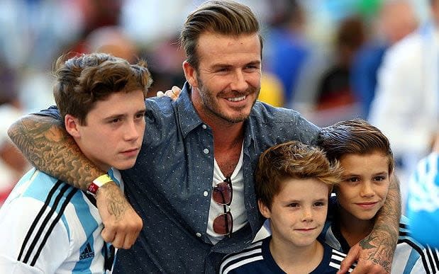 David Beckham and his sons (left to right) Brooklyn, Cruz and Romeo - Getty