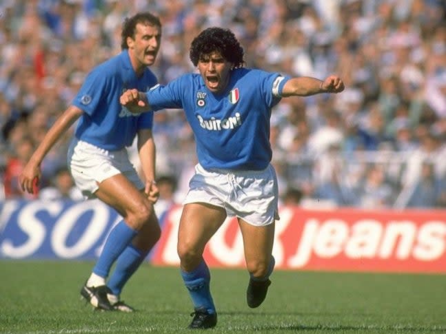 <p>Maradona celebrates while playing for Napoli</p>Getty