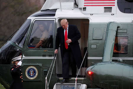 U.S. President Donald Trump steps out of the Marine One helicopter as he returns to the White House after U.S. Attorney General William Barr reported to congressional leaders on the submission of the report of Special Counsel Robert Mueller in Washington, U.S., March 24, 2019. REUTERS/Carlos Barria