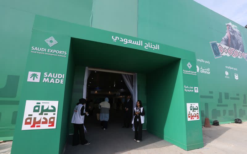 People stand outside a pavilion for Saudi Arabia at Baghdad International Fair, in Baghdad