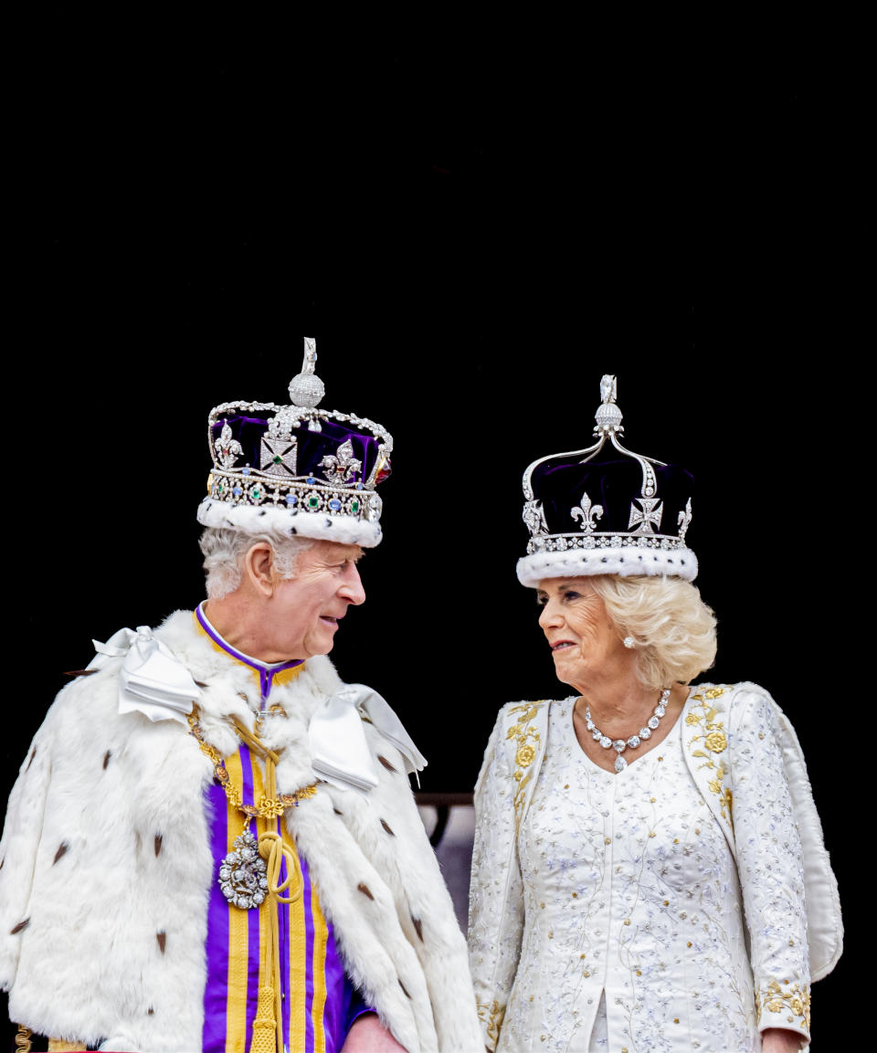 LONDON, ENGLAND - MAY 6: King Charles III and Queen Camilla wave at the balcony during the Coronation of King Charles III and Queen Camilla on May 6, 2023 in London, England. The Coronation of Charles III and his wife, Camilla, as King and Queen of the United Kingdom of Great Britain and Northern Ireland, and the other Commonwealth realms takes place at Westminster Abbey today. Charles acceded to the throne on 8 September 2022, upon the death of his mother, Elizabeth II. (Photo by P van Katwijk/Getty Images)