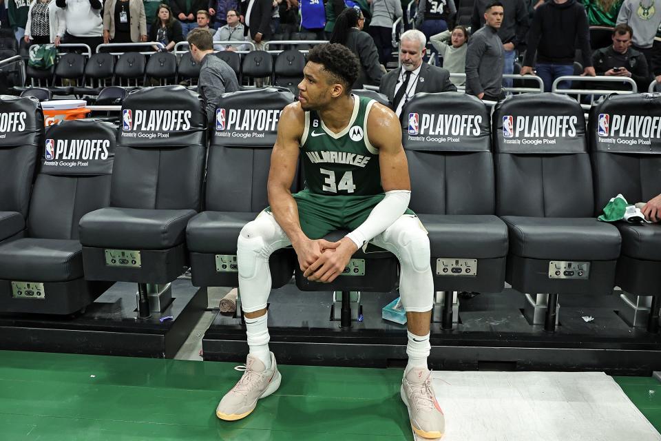 Giannis Antetokounmpo sits on the bench after the Bucks were eliminated from the first round of the playoffs.