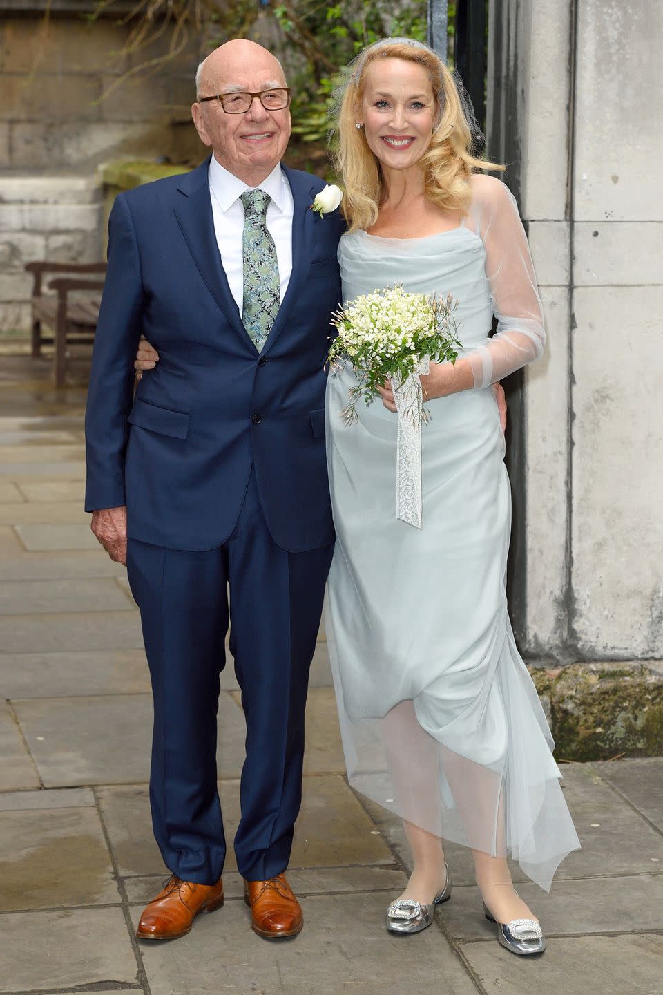 <p>Instead of wearing white (technically it was her first wedding, since her 1990 nuptials to Mick Jagger were annulled), the model and actress wore a light blue <span class="redactor-unlink">Vivienne Westwood</span> dress. </p>