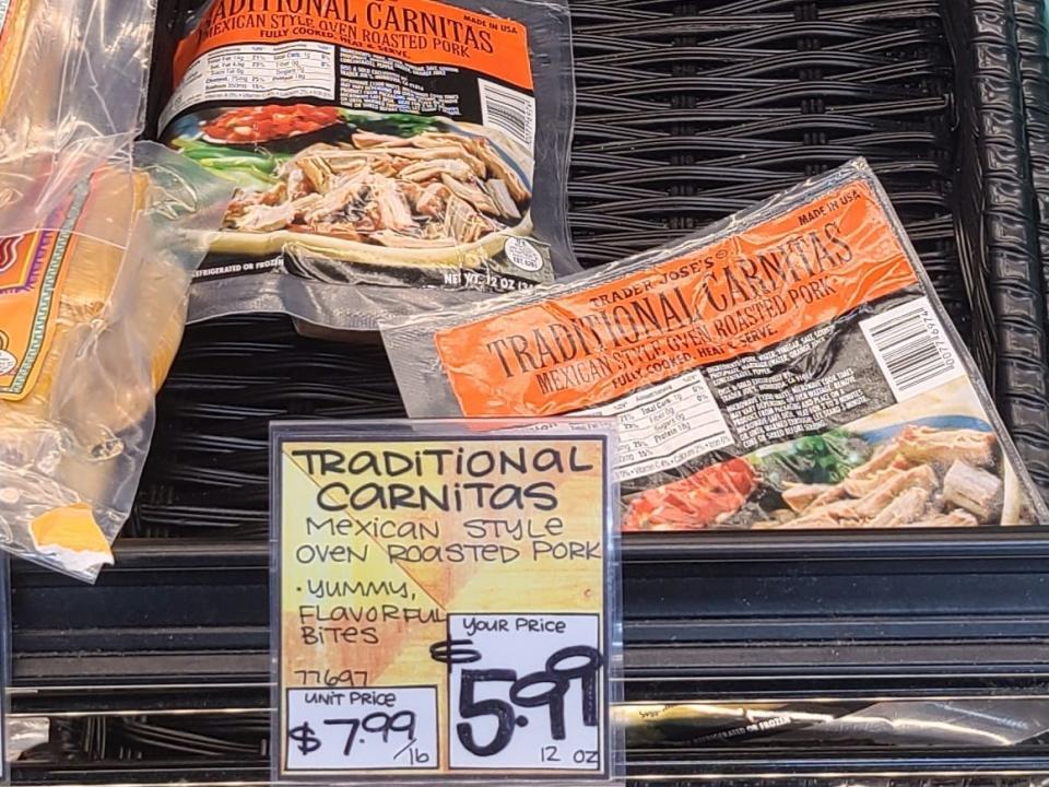 packages of carnitas in the fridge aisle at trader joes