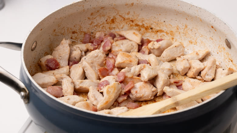 chicken and bacon in pan