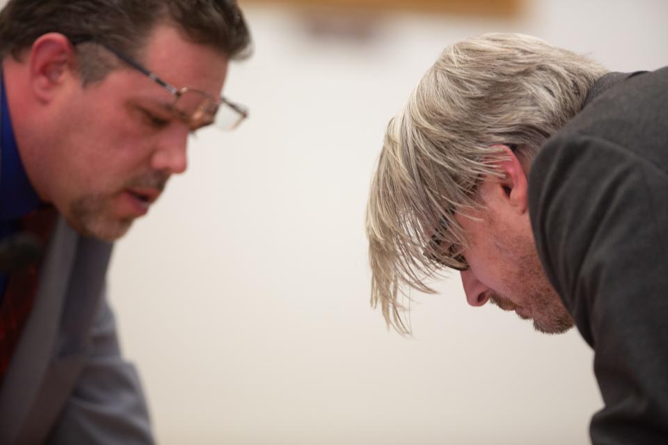 Scott William Jacobs Jr., left, and Jonathon L. Noble, right, review documents Monday during the sentencing hearing for their client, Serena Marie Sanchez.