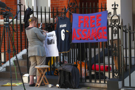 Supporters of Julian Assange, who remains inside the Ecuadorian embassy, place messages of support on railings around the embassy in central London, Britain, July 23, 2018. REUTERS/Hannah McKay