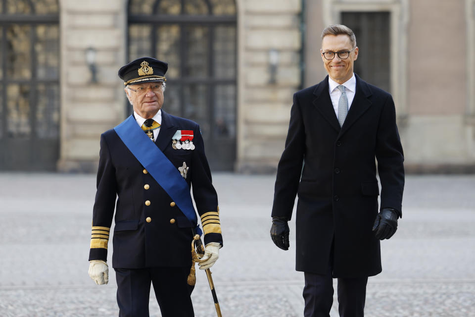 Swedish King Carl Gustaf, left, and President of Finland Alexander Stubb, review the Grenadier Guards of the Life Guards at the Inner courtyard at the Royal Palace in Stockholm on the occasion of Stubb's two-day visit to Sweden, Tuesday, April 23, 2024. (Christine Olsson/TT News Agency via AP)