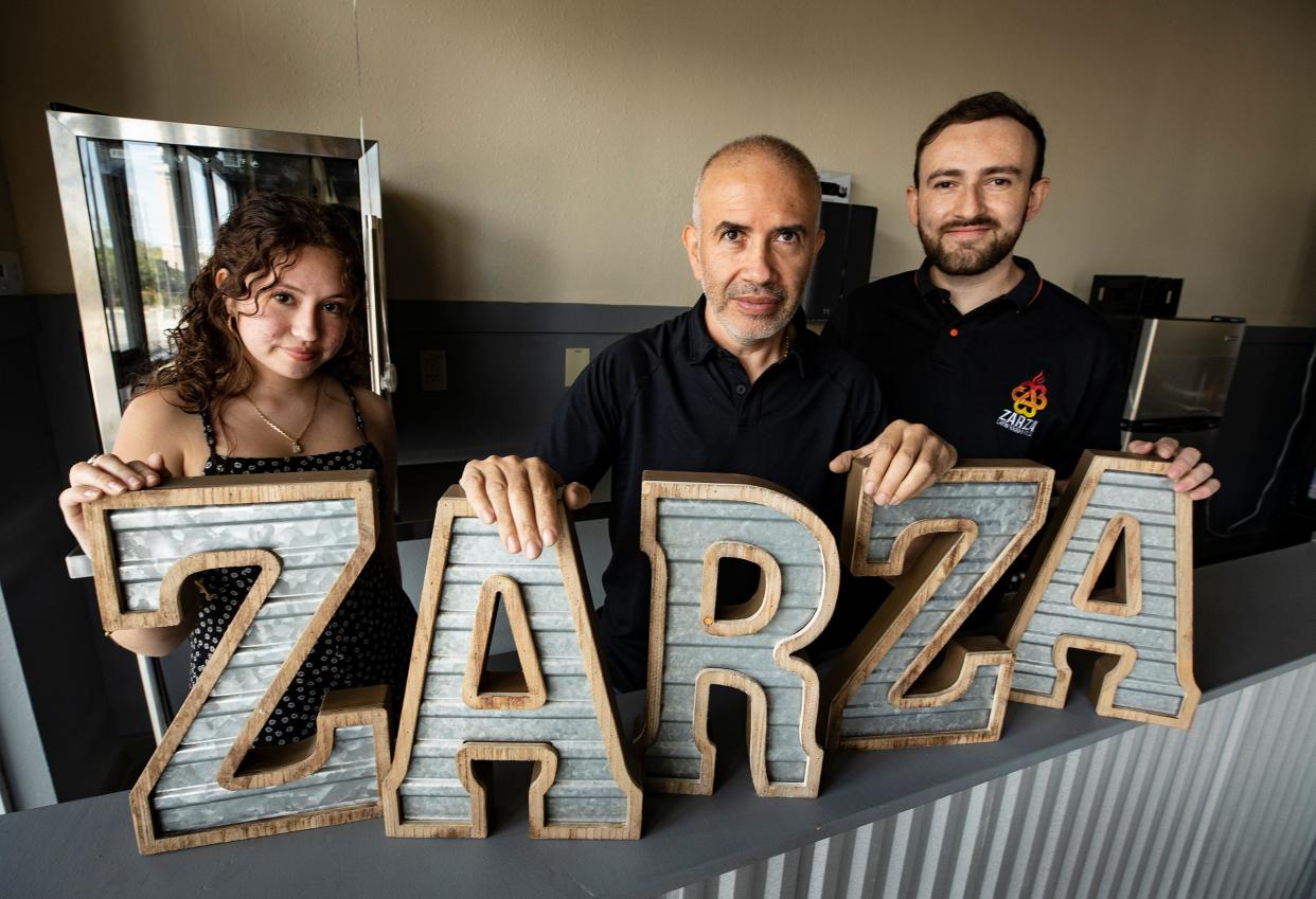 From left, Angelina Avelino, father Richard Avelino and chef Julian Montoya at the new location of their Zarza restaurant in Winter Haven. The Avelino family opened its first Zarza location in South Lakeland in 2017, and it's thrived.