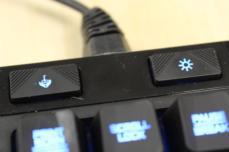 The left button controls whether the Windows shortcut key is enabled or not. The right button controls how bright the backlights are; there are a few settings to choose from.
