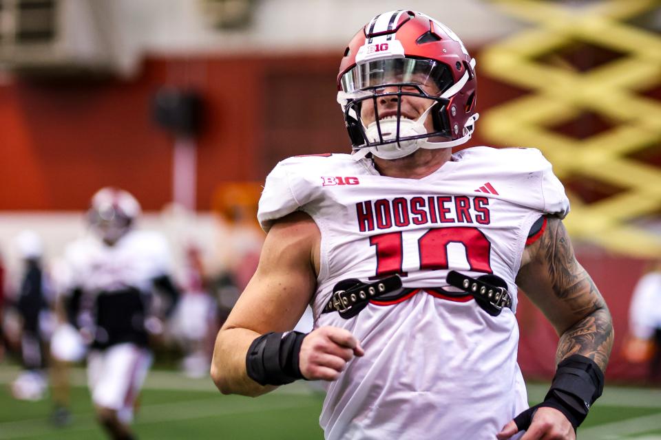 Indiana linebacker Aiden Fisher warms up during practice at Mellencamp Pavilion in Bloomington, IN.