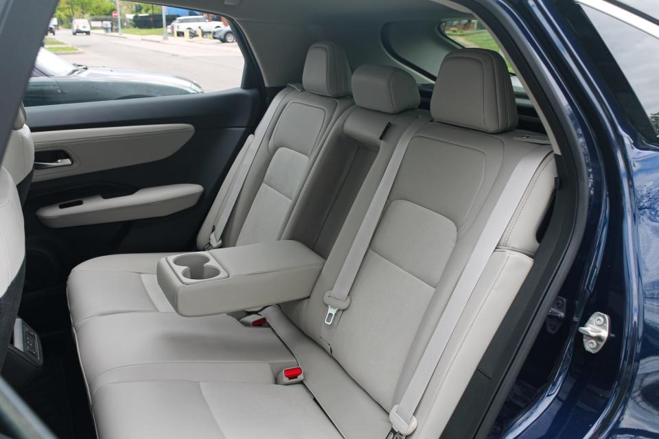 The white back seats of the 2023 Nissan Ariya SUV.