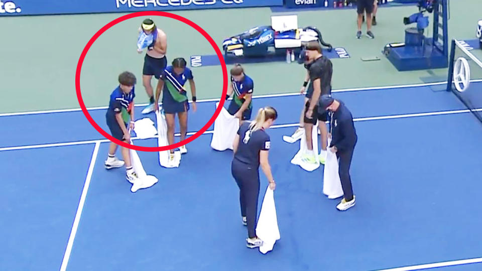 US Open ball kids, pictured here drying the court after Lloyd Harris' outburst.