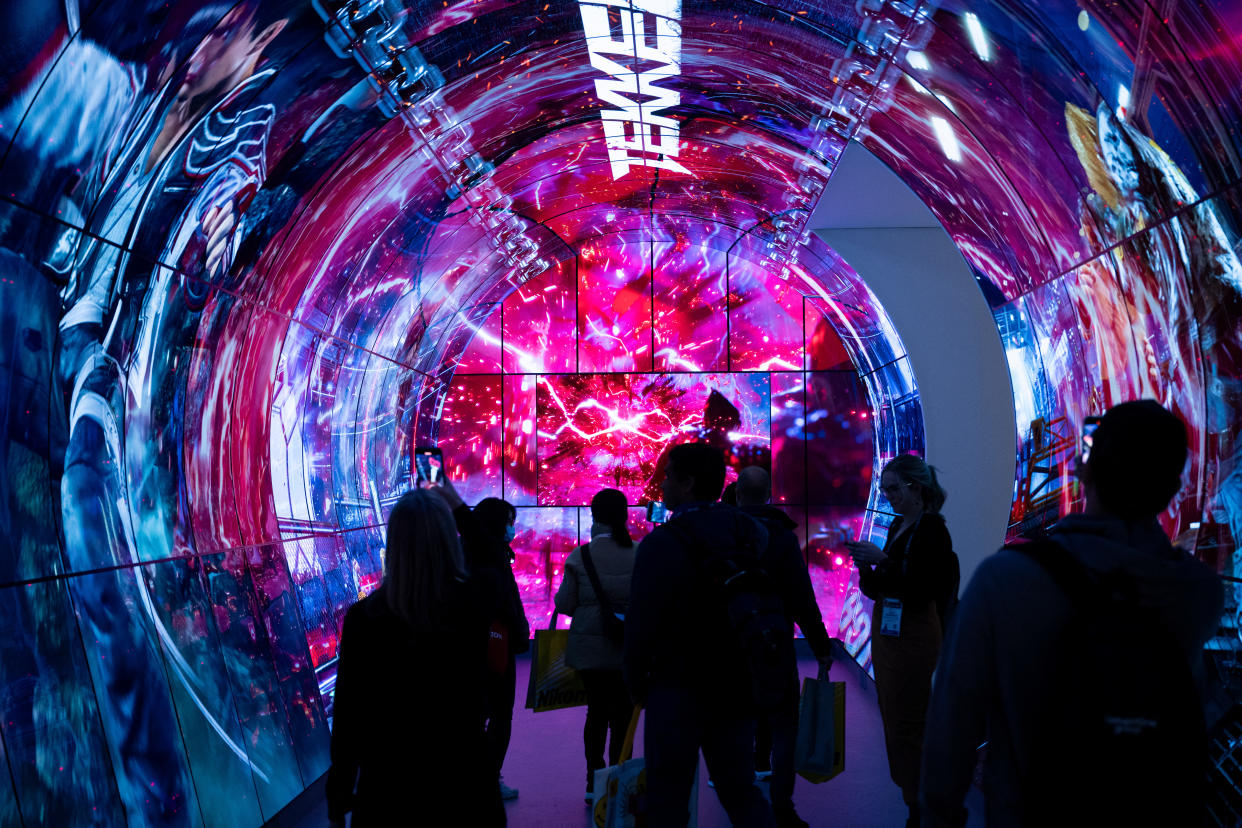 People visit an exhibit by LG at the Las Vegas Convention Center during the Consumer Electronics Show (CES) in Las Vegas, Nevada on January 10, 2024. (Photo by Brendan Smialowski / AFP) (Photo by BRENDAN SMIALOWSKI/AFP via Getty Images)