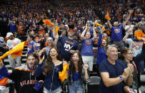 New York Islanders fans cheer a goal in the second period against the Tampa Bay Lightning of Game 4 of an NHL hockey Stanley Cup semifinal, Saturday, June 19, 2021, in Uniondale, N.Y. (AP Photo/Jim McIsaac)