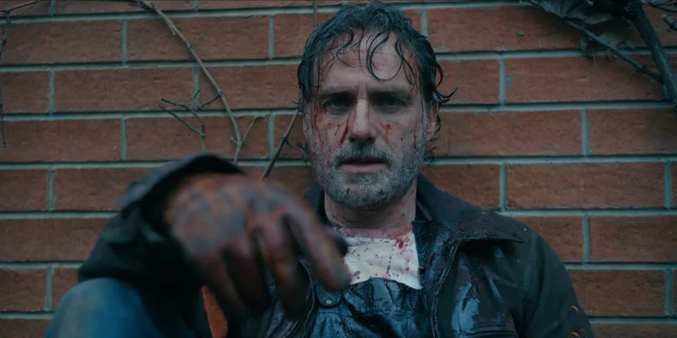 Andrew Lincoln sitting while covered in blood and sweat on "TWD: The Ones Who Live."