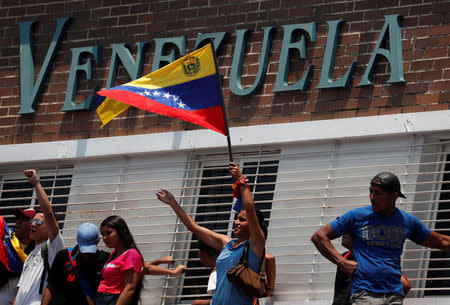 Supporters of Venezuelan opposition leader Juan Guaido, who many nations have recognised as the country's rightful interim ruler, take part in a rally against Venezuelan President Nicolas Maduro's government, in Valencia, Venezuela March 16, 2019. REUTERS/Carlos Jasso