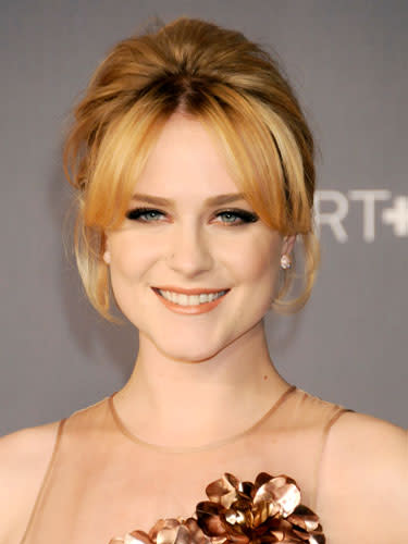 <div class="caption-credit"> Photo by: Getty Images</div><div class="caption-title">Evan Rachel Wood</div>For Wood's style, bigger is better. Center part hair and curtain bangs, literally making them appear like drapes. Begin to tease and spray hair right behind the bangs, ultimately smoothing it down with your hands and pinning the back up. <br> <br> <b>More from REDBOOK:</b> <br> <ul> <li> <a rel="nofollow noopener" href="http://www.redbookmag.com/beauty-fashion/tips-advice/winter-accessories?link=rel&dom=yah_life&src=syn&con=blog_redbook&mag=rbk" target="_blank" data-ylk="slk:100 Cute, Affordable Winter Accessories;elm:context_link;itc:0;sec:content-canvas" class="link "><b>100 Cute, Affordable Winter Accessories</b></a> </li> <li> <a rel="nofollow noopener" href="http://www.redbookmag.com/beauty-fashion/tips-advice/celebrity-makeup-looks?link=rel&dom=yah_life&src=syn&con=blog_redbook&mag=rbk" target="_blank" data-ylk="slk:The 50 Most Iconic Beauty Looks of All Time;elm:context_link;itc:0;sec:content-canvas" class="link "><b>The 50 Most Iconic Beauty Looks of All Time</b></a> </li> </ul>