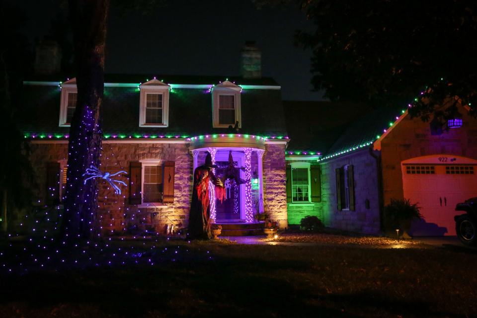 Green and purple lights illuminate the home at 922 E. Stanford St. on Saturday, Oct. 7, 2023.