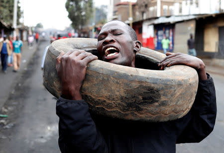 A supporter of opposition leader Raila Odinga shouts in Kibera slum in Nairobi, Kenya, August 11, 2017. REUTERS/Goran Tomasevic