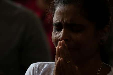 A member of Zion Church, which was bombed on Easter Sunday, cries as she prays at a community hall in Batticaloa, Sri Lanka, May 5, 2019. REUTERS/Danish Siddiqui