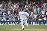 England's Joe Root celebrates after reaching a century during the third day of the 2nd test match between England and New Zealand at Trent Bridge in Nottingham, England, Sunday, June 12, 2022. (AP Photo/Rui Vieira)
