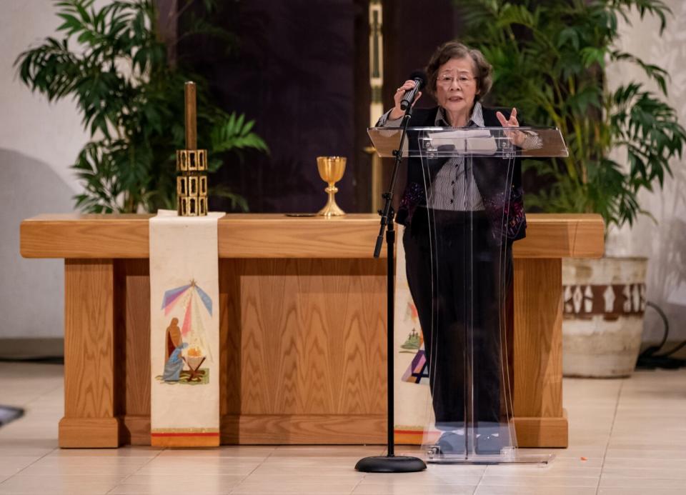 Shooting survivor Feng Feng Lee speaks during the one-year anniversary memorial service