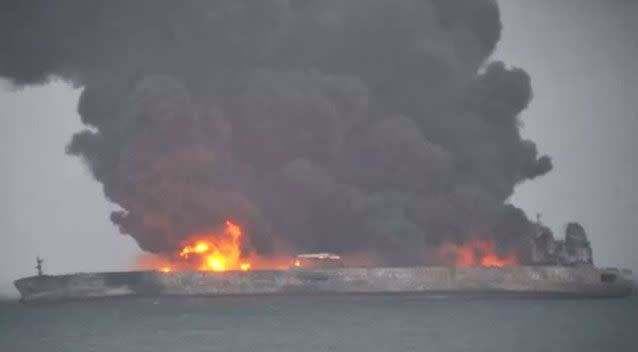 The oil tanker remains on fire and could sink off the coast of Shanghai. Source: People's Daily China