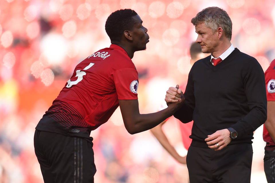 Manchester United's French midfielder Paul Pogba (L) shakes hands with Manchester United's Norwegian manager Ole Gunnar Solskjaer (R) on the pitch after  the English Premier League football match between Manchester United and Cardiff City at Old Trafford in Manchester, north west England, on May 12, 2019. - Cardiff won the game 2-0. (Photo by Oli SCARFF / AFP) / RESTRICTED TO EDITORIAL USE. No use with unauthorized audio, video, data, fixture lists, club/league logos or 'live' services. Online in-match use limited to 120 images. An additional 40 images may be used in extra time. No video emulation. Social media in-match use limited to 120 images. An additional 40 images may be used in extra time. No use in betting publications, games or single club/league/player publications. /         (Photo credit should read OLI SCARFF/AFP/Getty Images)