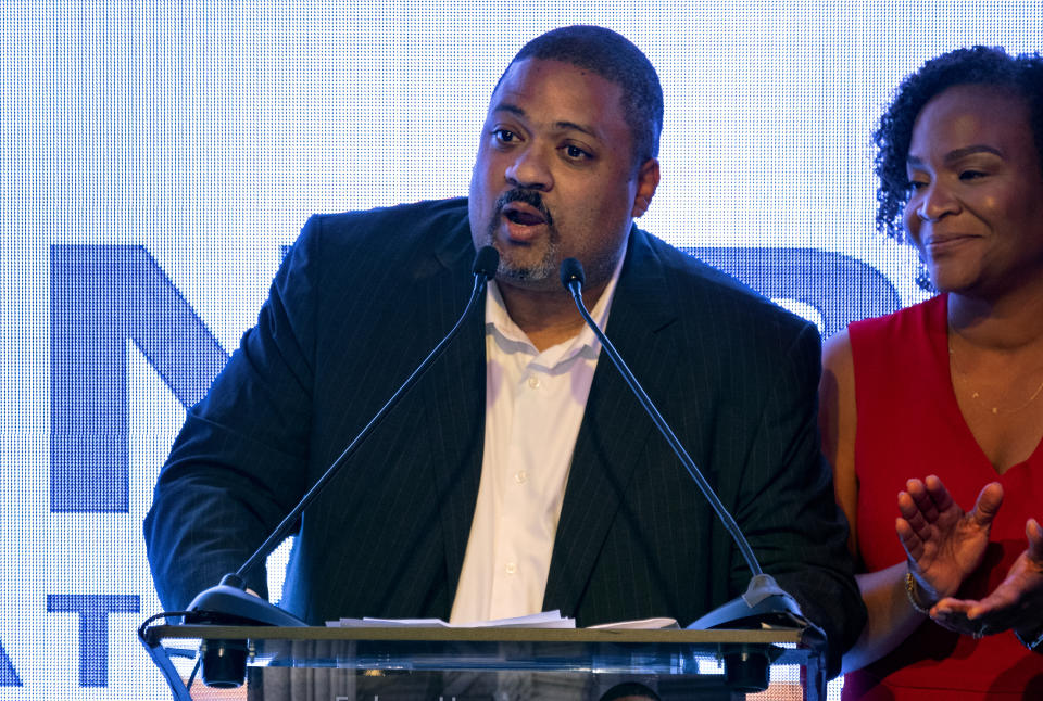 Alvin Bragg, a former top deputy to New York's attorney general, stands with his wife, Jamila Bragg, at an election night gathering as he speaks to supporters in New York, late Tuesday, June 22, 2021. (AP Photo/Craig Ruttle)