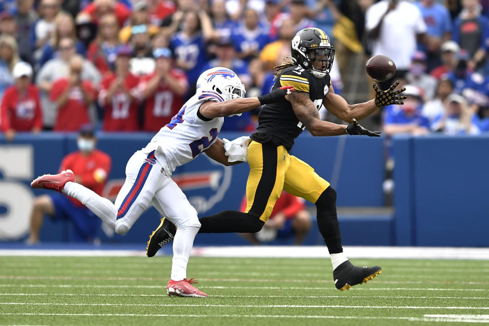 Pittsburgh Steelers wide receiver Chase Claypool (11) makes a catch with Buffalo Bills cornerback Taron Johnson defending during the second half of an NFL football game in Orchard Park, N.Y., Sunday, Sept. 12, 2021. The Steelers won 23-16. (AP Photo/Adrian Kraus)