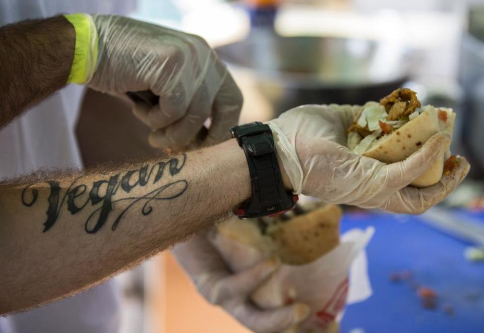 Cook prepares wheat-based shawarma