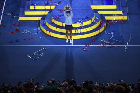 Sep 8, 2018; New York, NY, USA; Naomi Osaka of Japan poses with the championship trophy after defeating Serena Williams of the United States (not pictured) on day thirteen of the 2018 U.S. Open tennis tournament at USTA Billie Jean King National Tennis Center. Danielle Parhizkaran-USA TODAY Sports