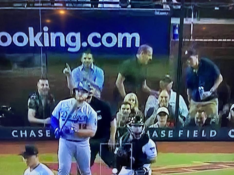 In an image taken from a television screen, former Phoenix City Councilman Sal DiCiccio (black shirt) is shown standing in the batter's box suite on Oct. 11, 2023, as the Arizona Diamondbacks played the Los Angeles Dodgers in a divisional series.