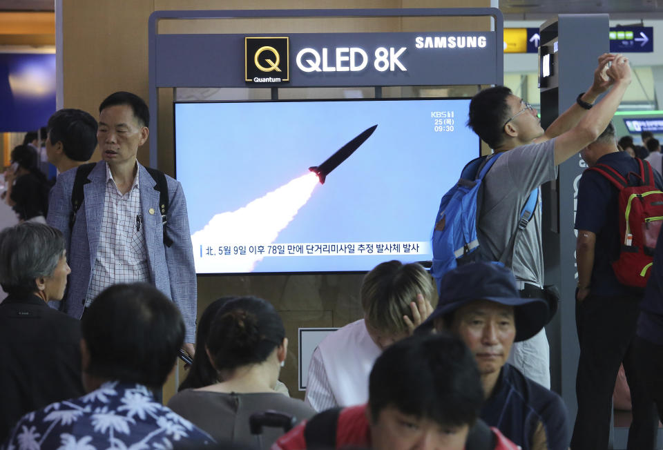 A TV screen shows a file image of North Korea's missile launch during a news program at the Seoul Railway Station in Seoul, South Korea, Thursday, July 25, 2019. North Korea fired two unidentified projectiles into the sea on Thursday, South Korea's military said, the first launches in more than two months as North Korean and U.S. officials struggle to restart nuclear diplomacy. The signs read: "North Korea fired after May 9." (AP Photo/Ahn Young-joon)