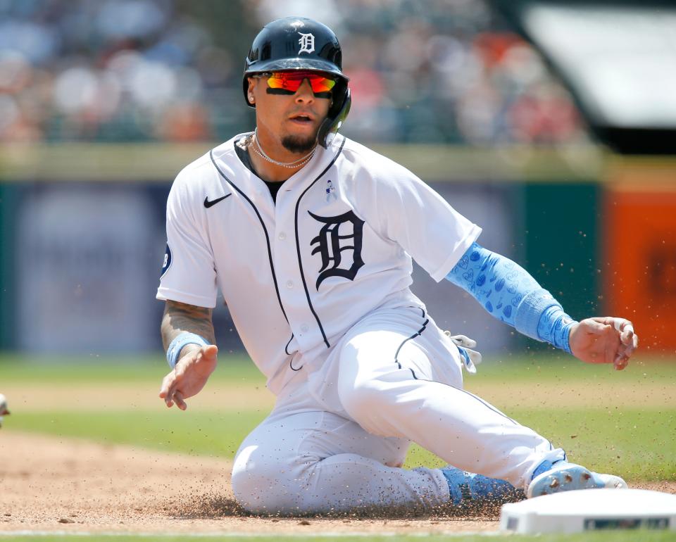 Javier Baez (28) of the Detroit Tigers steals third base during the first inning of a game against the Texas Rangers at Comerica Park on June 19, 2022, in Detroit, Michigan.