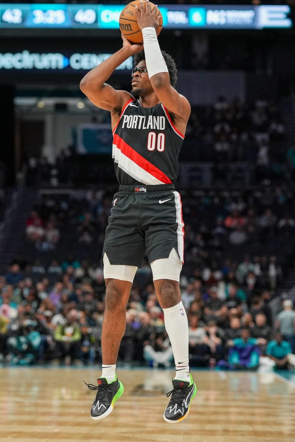 Apr 3, 2024; Charlotte, North Carolina, USA; Portland Trail Blazers guard Scoot Henderson (00) shoots from outside against the Charlotte Hornets during the second quarter at Spectrum Center.