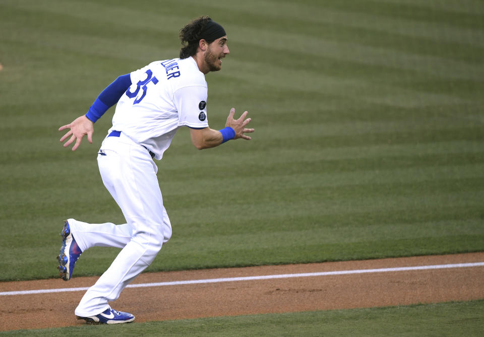 LOS ANGELES, CALIFORNIA - JUNE 02: Cody Bellinger #35 of the Los Angeles Dodgers reacts as he runs home to score on a throwing error from Edmundo Sosa #63 of the St. Louis Cardinals, to take a 4-1 lead, during the first inning at Dodger Stadium on June 02, 2021 in Los Angeles, California. (Photo by Harry How/Getty Images)