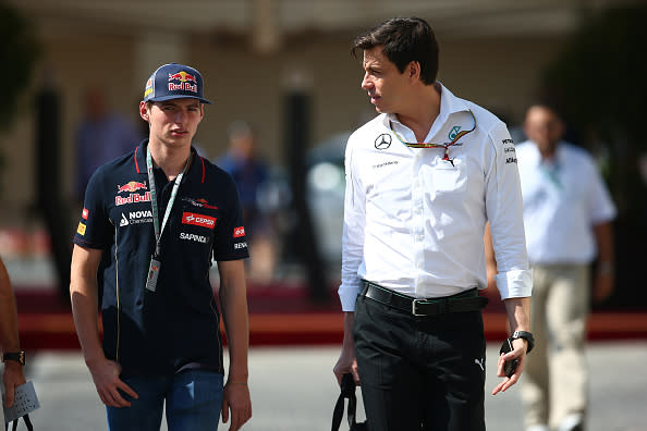 ABU DHABI, UNITED ARAB EMIRATES - NOVEMBER 22:  Max Verstappen of the Netherlands and Scuderia Toro Rosso speaks with Mercedes GP Executive Director Toto Wolff as he arrives in the paddock before final practice ahead of the Abu Dhabi Formula One Grand Prix at Yas Marina Circuit on November 22, 2014 in Abu Dhabi, United Arab Emirates.  (Photo by Mark Thompson/Getty Images)