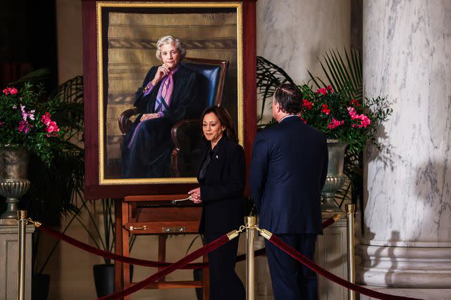 <p>Valerie Plesch/Bloomberg via Getty</p> US Vice President Kamala Harris and Second Gentleman Doug Emhoff walk past a portrait of late Supreme Court Justice Sandra Day O'Connor as they pay their respects in the Great Hall of the US Supreme Court in Washington, DC, US, on Monday, Dec. 18, 2023.