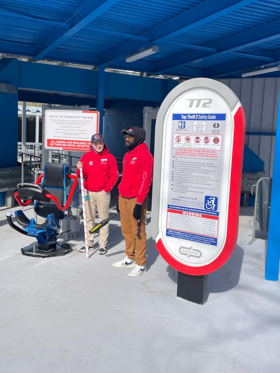 Cedar Point workers stand at the entrance to the Top Thrill 2 roller coaster.