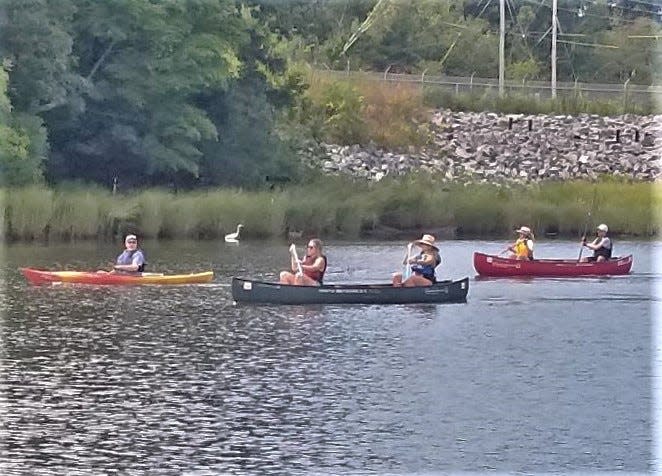 Fifty kayakers and canoeists paddled from Pawtucket to Providence Sunday to celebrate past and future efforts to clean and reclaim the Blackstone River.