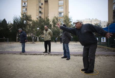 Members of the French community play boules at a club in Netanya, a city of 180,000 on the Mediterranean north of Tel Aviv, that has become the semi-official capital of the French community in Israel January 25, 2015. REUTERS/Ronen Zvulun