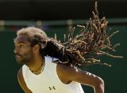 Dustin Brown of Germany servers during his match against Yen-Hsun Lu of Taiwan at the Wimbledon Tennis Championships in London, June 30, 2015. REUTERS/Henry Browne