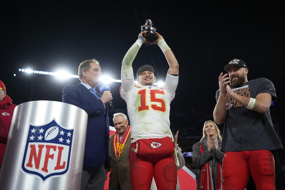 Kansas City Chiefs quarterback Patrick Mahomes (15) holds up the Lamar Hunt Trophy next to Kansas City Chiefs tight end Travis Kelce (87) after the AFC Championship NFL football game against the Baltimore Ravens, Sunday, Jan. 28, 2024, in Baltimore. The Chiefs won 17-10. (AP Photo/Matt Slocum)