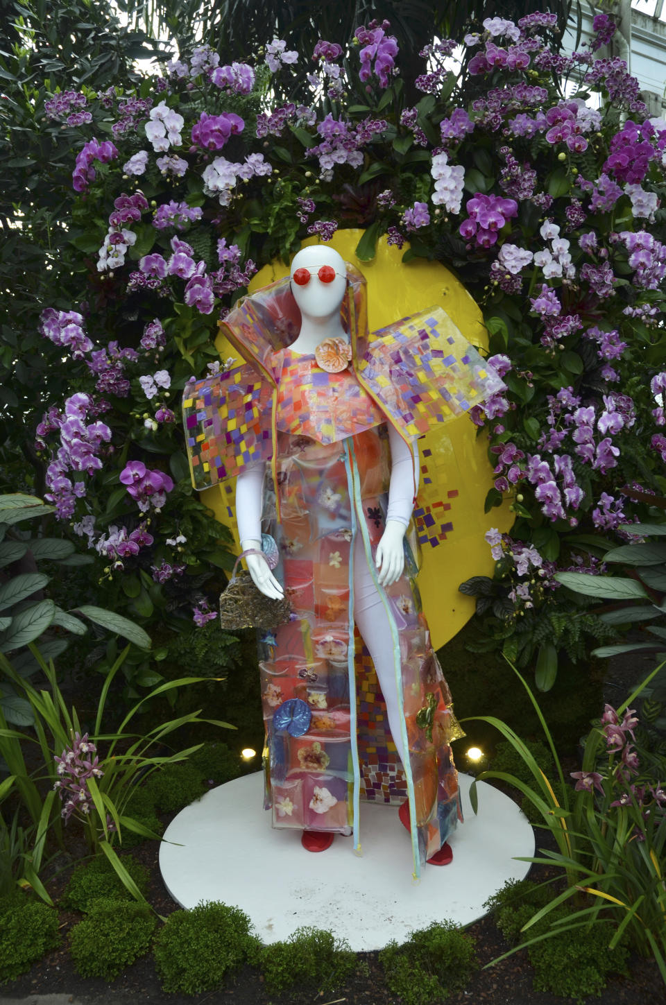 A fashion-creation inspired by nature from FLWR PSTL designed by Kristen Alpaugh in "The Orchid Show: Florals in Fashion" at The New York Botanical Garden, Saturday, Feb. 17, 2024, in the Bronx borough of New York. The mannequin wears iridescent painted anthurium plants. The exhibition is on through April 21, 2024. (AP Photo/Pamela Hassell)