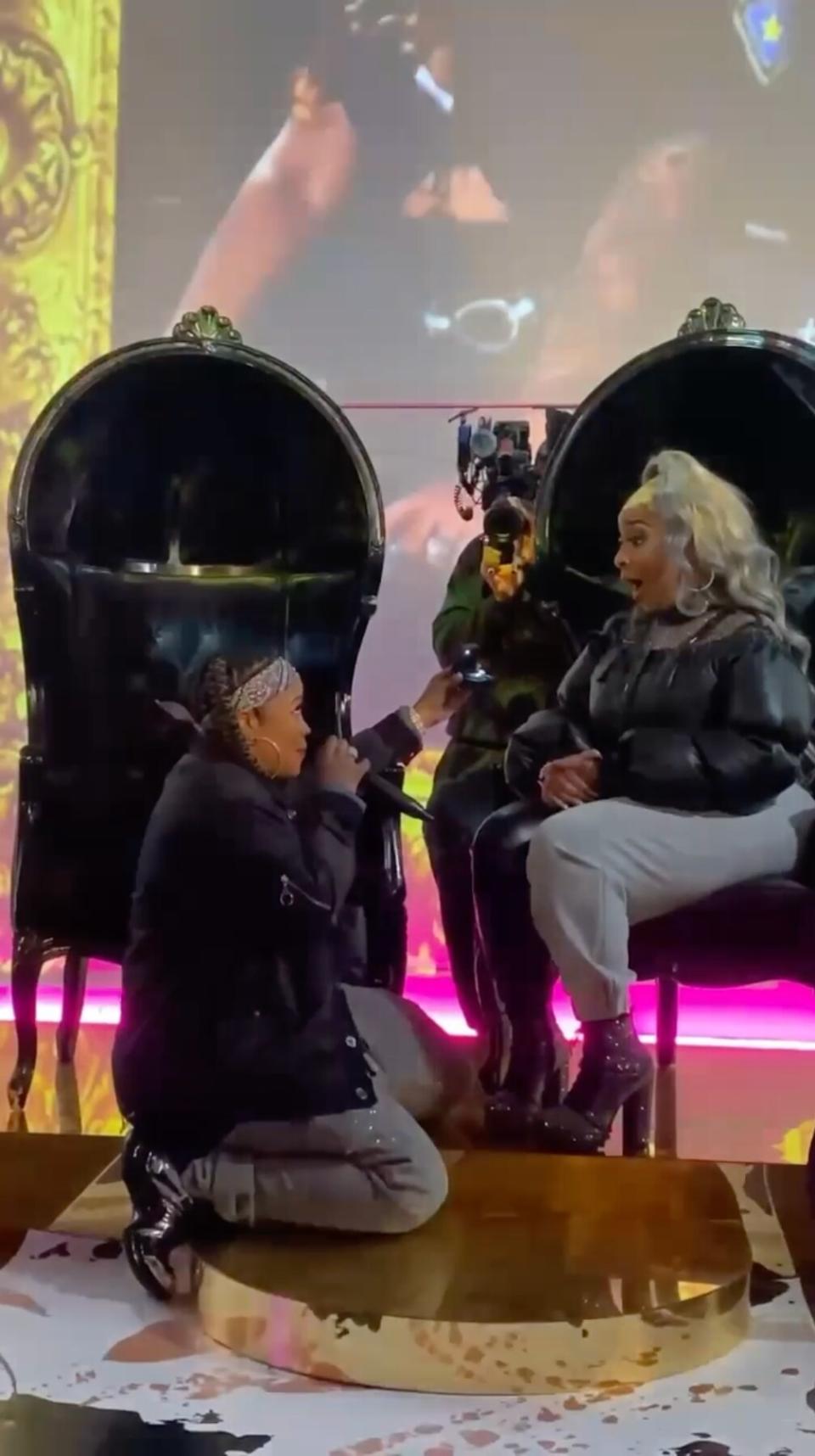 Rapper Da Brat (left) proposes to longtime girlfriend BB Judy in a screenshot from a proposal video. (via BB Judy Instagram post)