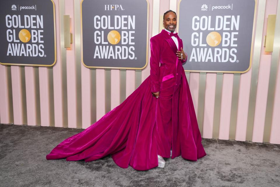 Billy Porter shuts down the Golden Globes red carpet in a fuchsia velvet tuxedo gown from Christian Siriano.