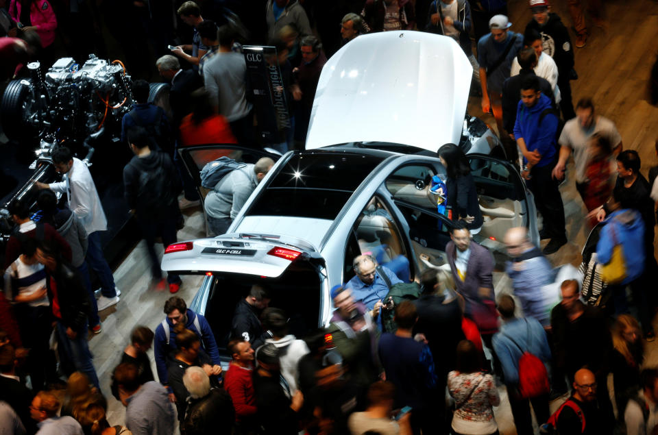 People walk around a Mercedes GLC F-Cell at the stand of German car manufacturer Mercedes at the Frankfurt Motor Show (IAA) in Frankfurt, Germany September 16, 2017. REUTERS/Ralph Orlowski